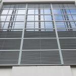metal blinds on the window of an industrial building