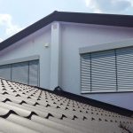 The slope of the roof with a metal tile brown