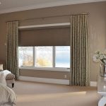 Interior of a modern bedroom with roller blinds