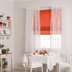 Red Roman blind over the window - beautiful decor of the kitchen window