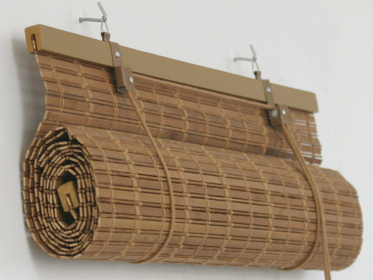 Bamboo curtain of slats on two hooks
