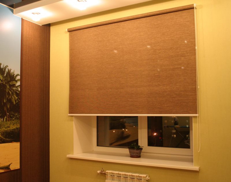Brown curtain roll type on the kitchen window