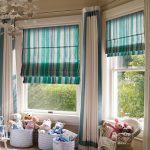 Striped cascading curtains on separate windows