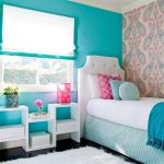 Turquoise wall with a window in the children's bedroom