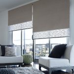 Double roller blinds in the living room interior