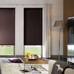 Blinds with guides on the windows of the living room