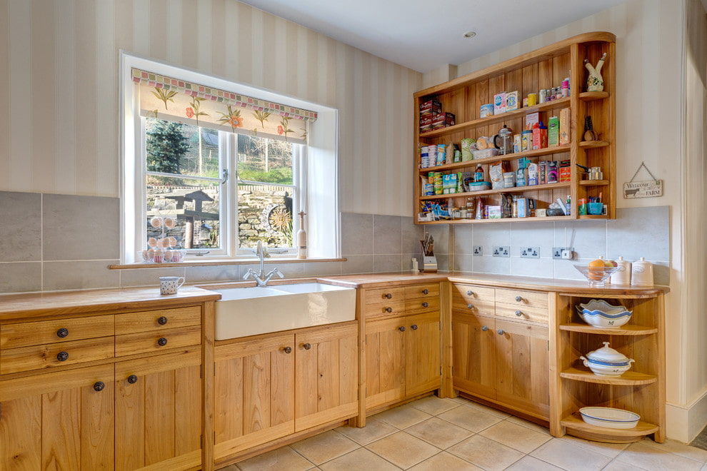 Country style kitchen interior with roller blinds