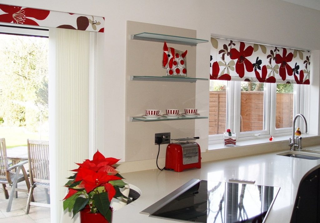 Blinds with flowers on the kitchen windows