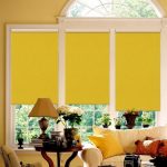 Yellow curtains on a plastic window