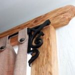 Homemade eaves of wood with wrought iron elements