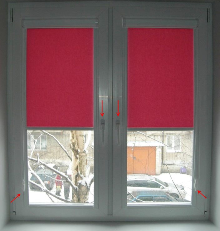 Pink roll-up curtains on a plastic window