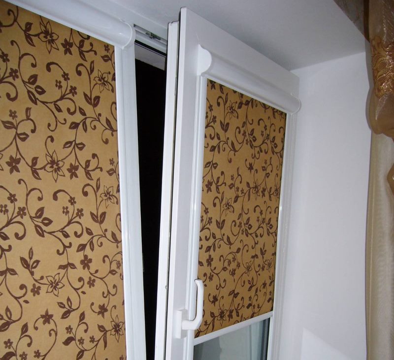 Closed roller blinds on a plastic window