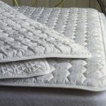 Thin quilted mattress to protect the surface