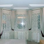 White curtain with an embossed pattern for a bay window