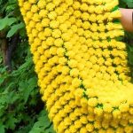 Grote gele deken van pompons Zon