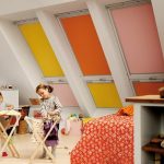 Multicolored roller blinds on the skylights