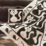 Interesting bedspread with cats