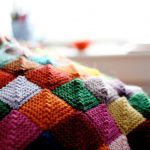 Unusual blanket of small knitted squares