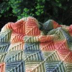 Autumn cover crocheted from squares with rolling colors