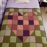 Bedspread with sredts on a green background of knitted elements