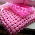 Fluffy rosa filt på urladdning