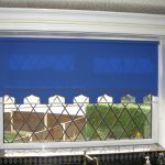 Blue roller blind on the kitchen window