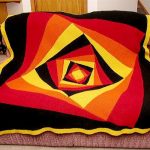 A chic multicolored blanket with sinking squares