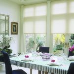 Dining table in front of french window
