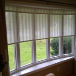 Curved PVC window with roller blinds