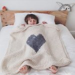 Knitted bedspread with a heart in the center