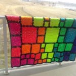 Bright cover in patchwork technique from elements of different sizes
