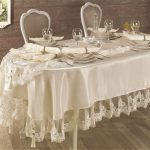 Satin tablecloth with openwork decor - stylish and beautiful
