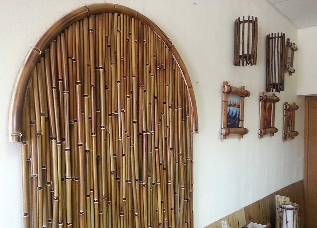 Wooden bamboo curtains in the doorway arch