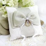 White-gray pillow with bow for rings