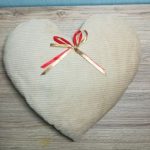White heart cushion with bow