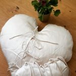Snow-white heart pillow with ties