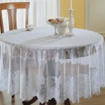 Snow-white festive tablecloth on a round table