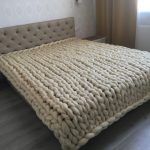 A beige wool blanket will perfectly decorate your bedroom