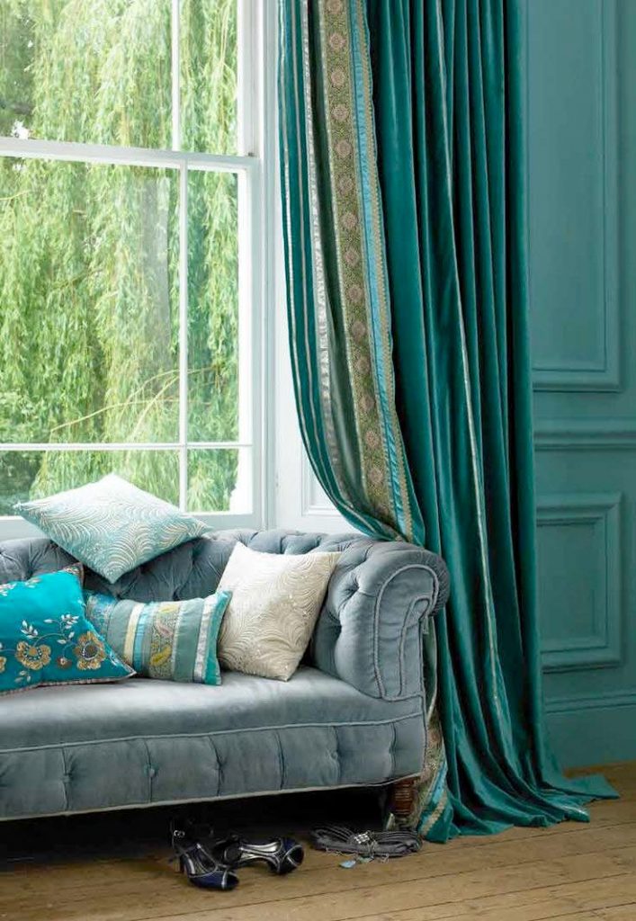Direct turquoise curtain on the window in the living room