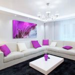 Purple pillows on a white sofa
