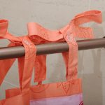 Fastening curtains in the bathroom on the ribbons