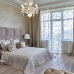 Crystal chandelier on the ceiling of the bedroom