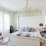 Black curtain rails in white bedroom