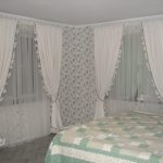 White curtains with fringe at the edges
