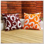 Brown and orange pillows with curls
