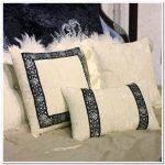 Beautiful pillows with decorative pebbles and rhinestones