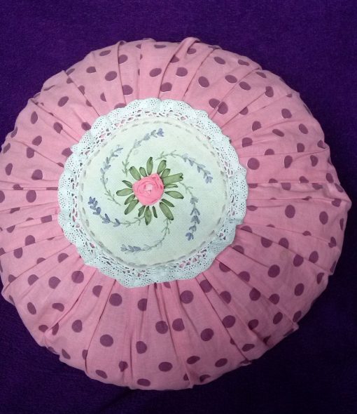 Round pillow with embroidery