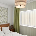 Green curtains in a small bedroom