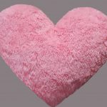 Furry pink heart-shaped pillow