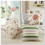 Cute decorative pillows with flowers and stripes